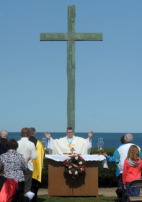 Father Jeffrey L. Nowak, of St. Vincent de Paul Parish, Niagara Falls, presides over the 91st annual Pilgrimage and Mass at the Father Millet Cross at Old Fort Niagara Sept. 10. The Knights of Columbus and area Catholics also celebrated the Mass. Since 1926, the Knights of Columbus have been celebrating a Mass at 